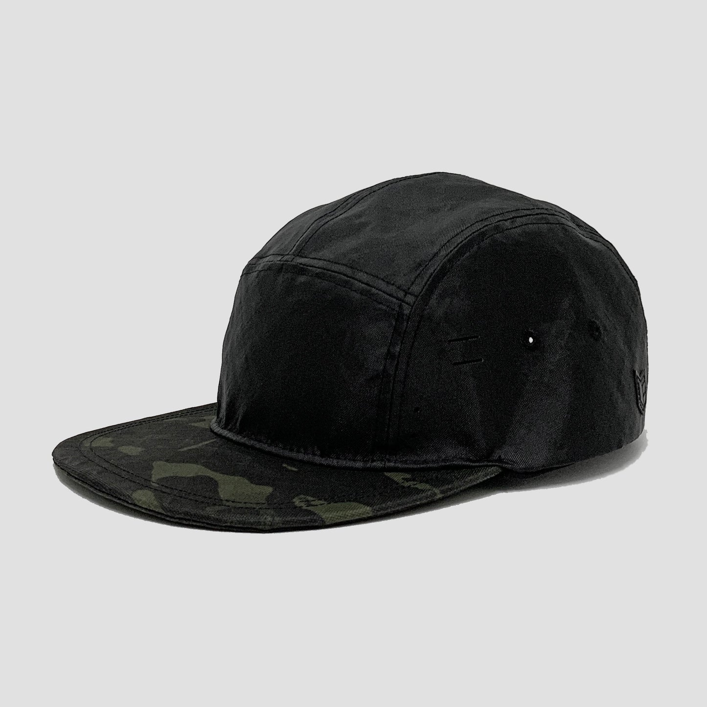 Utility hat made of durable waterproof coated ECOPAK™ fabric, with multiple laser-cut slits and ventilation openings, quick release adjustment strap, and reflexive tab for night time visibility.