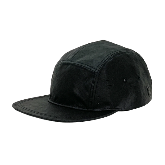 Utility hat made of durable waterproof coated ECOPAK™ fabric, with multiple laser-cut slits and ventilation openings, quick release adjustment strap, and reflexive tab for night time visibility.